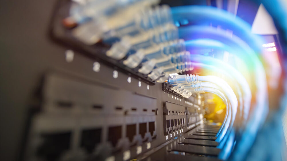 Blue network cable system in network rack have beautiful lighting and center picture focusing